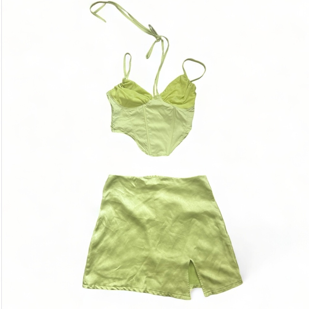green corset top and silk skirt
